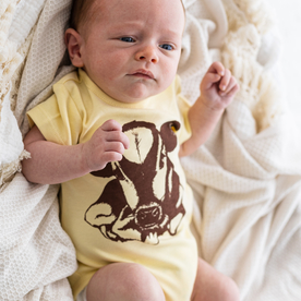 Baby bodysuit with calf print